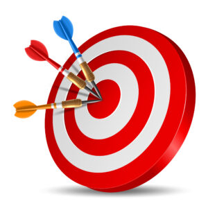 Red dart arrow hitting in the target center of dartboard